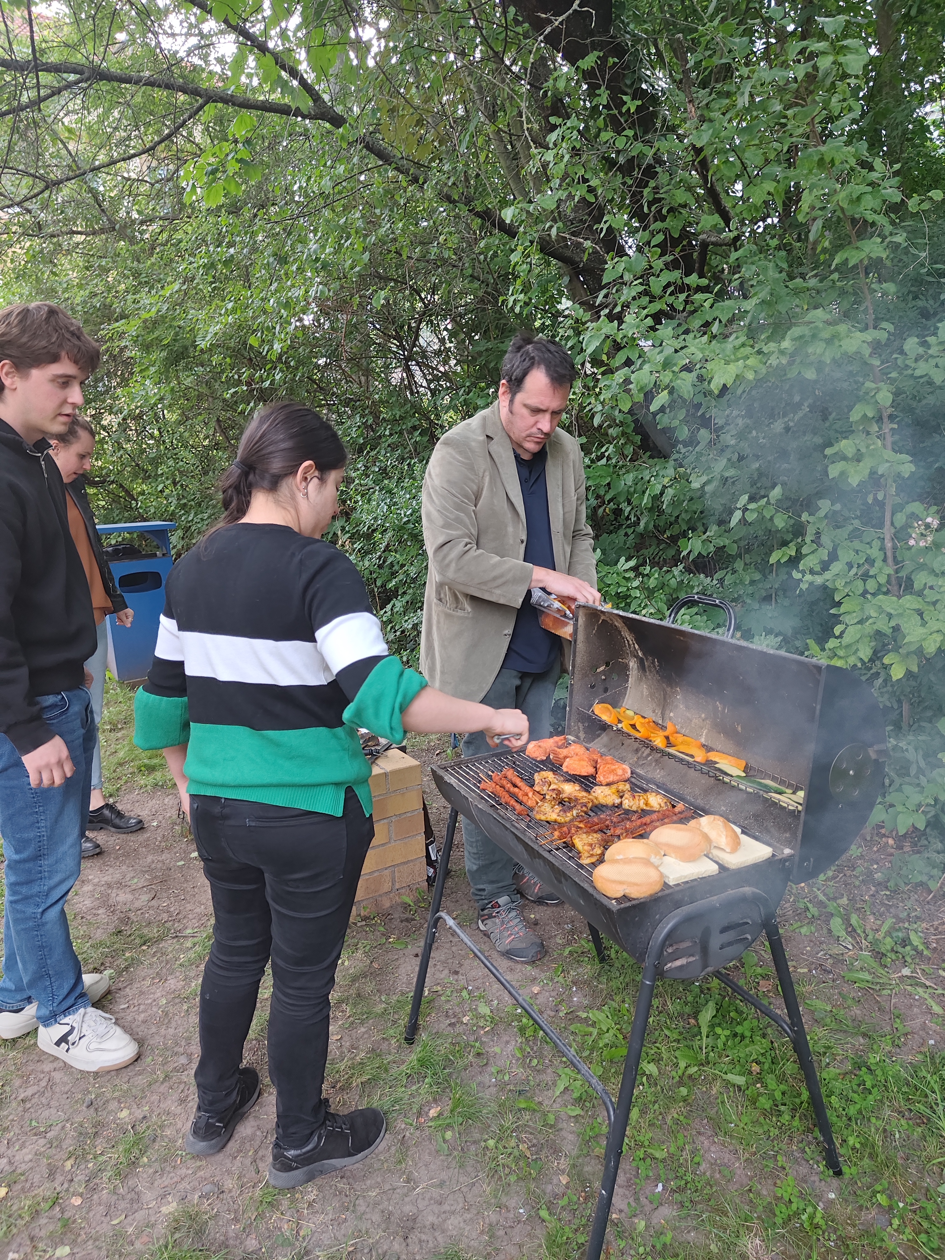 S. Bernuzzi, A. Gonzalez and J. Fontbuté preparing food for the workshop BBQ